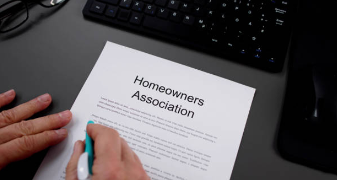 HOA Responsibility Water Leak : 7 Critical Things Every Homeowner and Property Manager Must Know Before It's Too Late 2 HOA responsibility water leak homeowner reviewing governing documents and CC&Rs