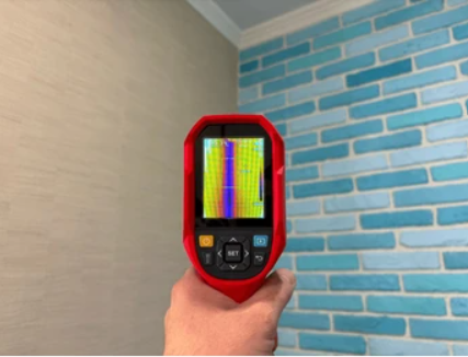 7 Proven Signs You Need Water Damage Experts Before It's Seriously Too Late 4 water damage experts using thermal imaging camera during property assessment in San Antonio